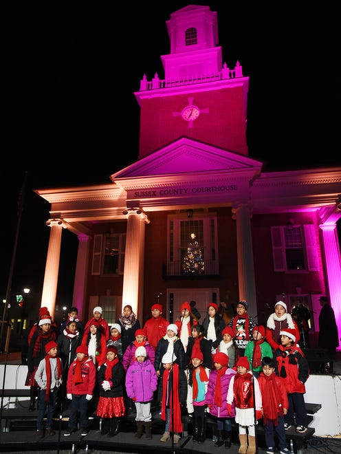Carolers sing in front of the Sussex courthouse during the annual Caroling on the Circle in Gerogetown.
