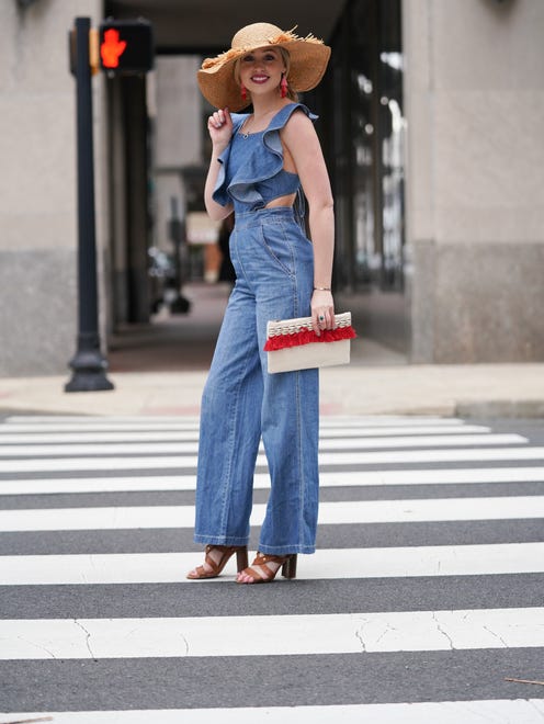 Sklyer Bouchard wears a Do + Be denim jumper with flared legs and ties in the back with ALDO caramel leather strappy heels