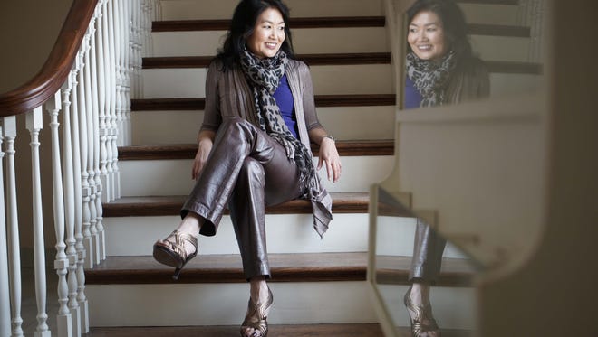 Pianist Hiroko Yamazaki models some of her favorite fashions at First and Central Presbyterian Church.