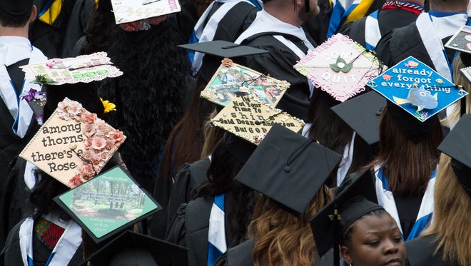 Decorated graduation caps at the Wesley College Spring Commencement in Dover.  A total of 244 graduated.