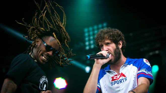 Lil Dicky (right) performs on the Lawn Stage on day two of Firefly Music Festival Friday at The Woodlands in Dover.