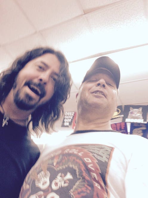 Dave Grohl with Rehoboth  Beach-based Beachcomber columnist and musician Roger Hillis on the Rehoboth Boardwalk Sunday.