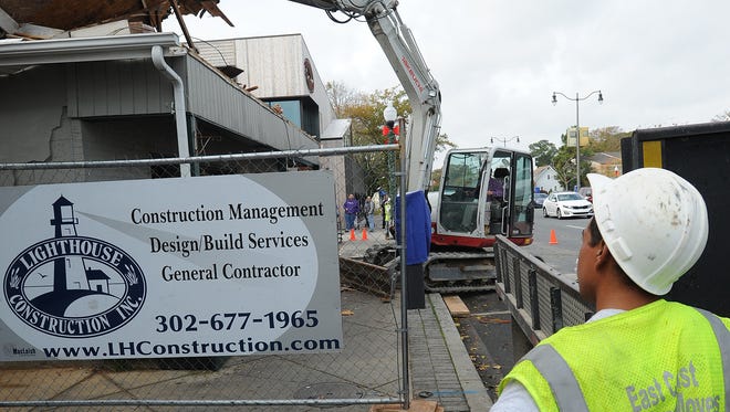 Demolition at the Dogfish Head's old brewpub on Rehoboth Ave. in downtown Rehoboth Beach began on Monday, Nov. 6, 2017 to make way for an outside courtyard between Chesapeake & Maine Restaurant and the new Dogfish Head Brewing and Eats.