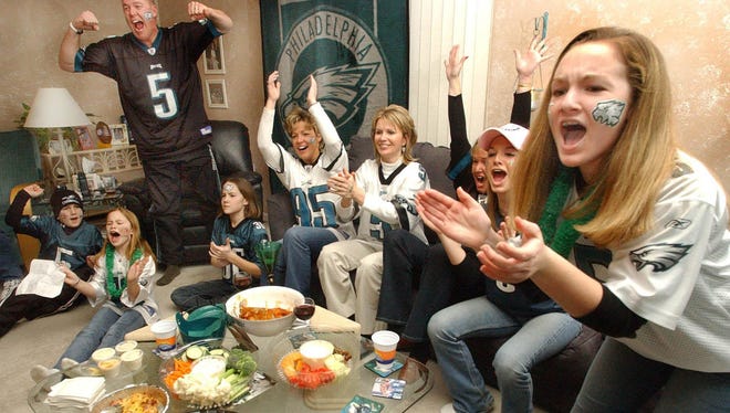 The Sheats and Weldon families watch Super Bowl XXXIX on Feb. 6, 2005 in Middletown. The Philadelphia Eagles lost the game to the New England Patriots, 24-21