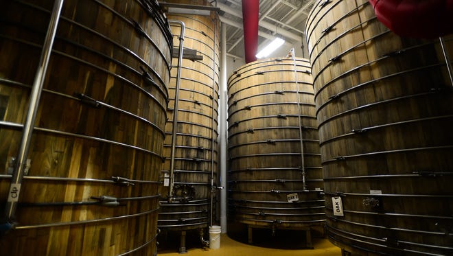 Dogfish Head's wooden fermentation tanks located at the Dogfish Head Brewery in Milton, Del. on Friday, July 14, 2017.
