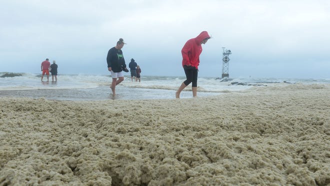 Thick sea foam forms at the Ocean City, Md. Inlet on Saturday, July 29, 2017 as a summer nor'easter passes through causing high winds, large waves and beach erosion.
