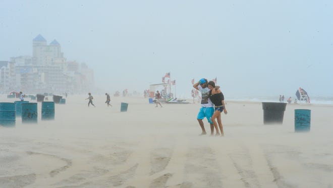 High winds from a summer nor'easter cause people to leave the beach in Ocean City, Md. on Saturday, July 29, 2017.