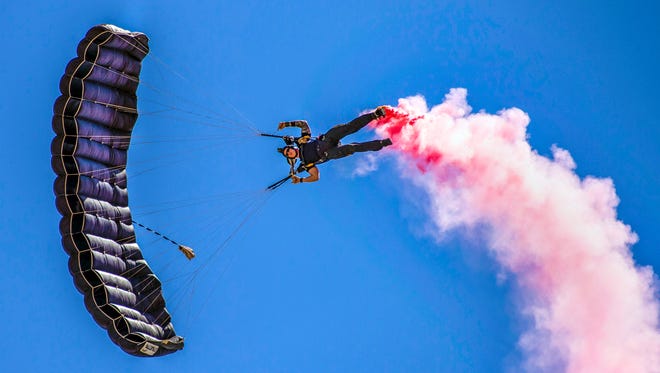 A member of the U.S. Special Operations Command Para-Commandos parachutes down during the Cannon Air Show, Space and Tech Fest at Cannon Air Force Base, N.M., May 26, 2018. The Para-Commandos are the only DoD Joint Service demonstration team consisting of members from every Military Service in SOCOM. (U.S. Air Force photo by Senior Airman Luke Kitterman/Released)