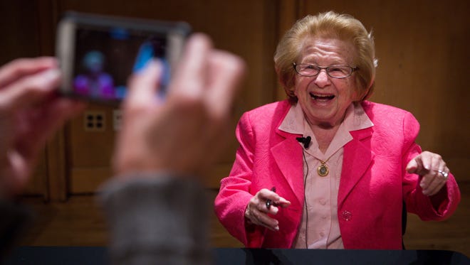 Psychosexual therapist Dr. Ruth Westheimer, smiles for a fan as she signs her latest book after giving a presentation at the Loudis Recital Hall of the Amy E. du Pont Music Building on the University of Delaware campus.