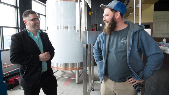 Rick Whittick, left, general manager and John Panasiewicz, head brewer, inside the new Iron Hill Brewery and Restaurant in Rehoboth that will be opening at the end of May.