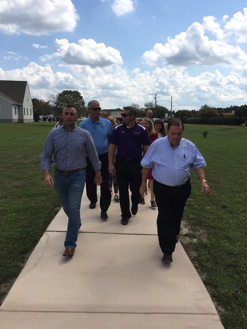 From left - Mayor Day, Fred Puente, and delegates Carl Anderton and Norman Conway walk the BISM Wellness Path