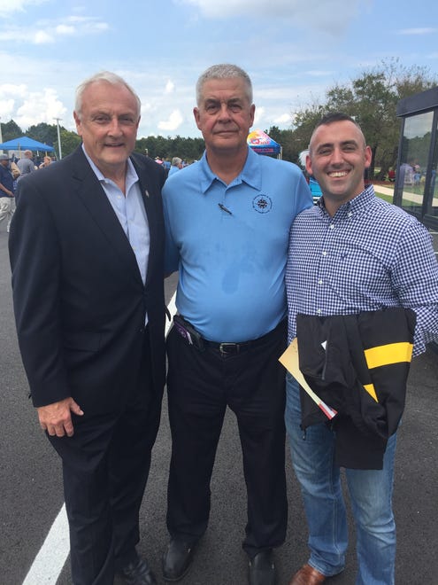 From left - State Senator Jim Mathias, BISM President Fred Puente, Salisbury Mayor Jacob Day. Puente presented Mayor Day with a personalized Army Physical Fitness Uniform Jacket produced by blind and sighted Salisbury employees.