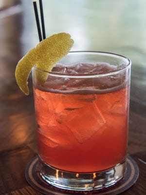 The Candle-Lit Harvest beer cocktail with rhubarb syrup, lemon juice, Campari Liqueur, Old Fitzgerald Bourbon and Monnik I.P.A., as prepared by Brandon "Habi" Habenstein, the bar manager for Monnik at 1036 E. Burnett Ave. in Schnitzelberg. May 5, 2016
