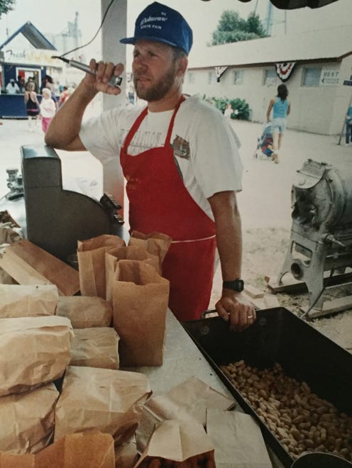 1992: Steve Hohman, owner of Hohman ' s Peanuts, calls to customers. See more vintage images of the Delaware State Fair.