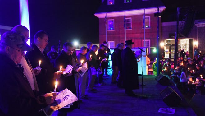 Elected officials joined hundreds to sing Christmas carols at the annual Georgetown event.