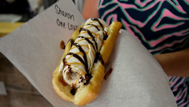 The Tall Charlie, from Sweet Charlie's, an ice cream roll served on a warm, long, glazed doughnut.