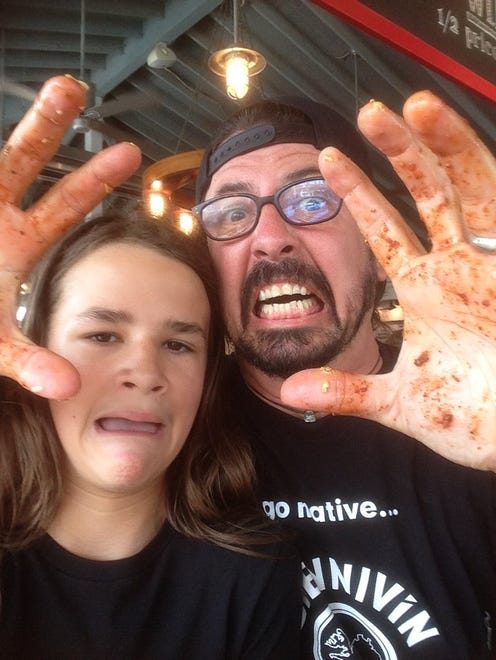 Dave Grohl with Jackson Anderson, guitarist for Annapolis, Maryland-based rock band Fast as Lightning, on Saturday, Aug. 6. Grohl stopped by The Point Crab House in Arnold, Maryland on his way home from Rehoboth Beach.