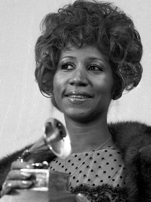 Aretha Franklin holds her Grammy Award for Best Rhythm and Blues performance for the song "Bridge Over Troubled Water," on March 13, 1972, in New York.