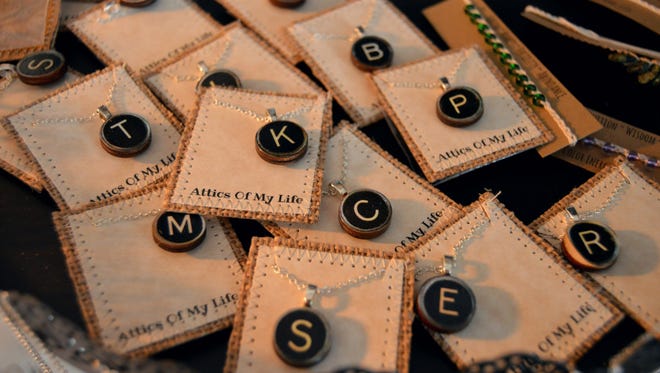 Vintage typewriter key inspired necklaces available at Attics of My Life.