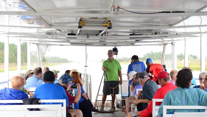 Captain Steve Cardano, Tour Guide, talks about oysters aboard the Cape Water Taxi Eco Tour on Wednesday, Sept. 27, 2017.