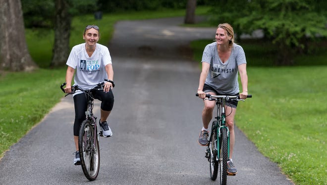 Silvana Oberto (left) of Bear and Laura McGowan of Wilmington enjoy the Bike & Hike event at Hagley Museum in Wilmington despite some unplanned rain.
