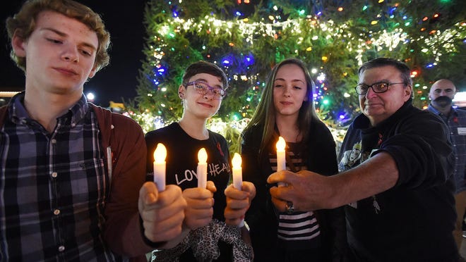 Students Evan Mallon, Lily Mallon, Allie Ibach and John Sophos all from Rehoboth with their candles.