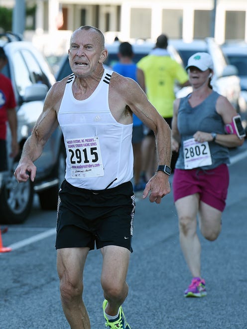 Clifton Anderson from Warrenton, VA. makes it to the finish line as Over 300 runners and walkers turned out for the 19th Annual Run for J.J. 5K & 5K Walk held on Sunday July 24th in downtown Rehoboth Beach.