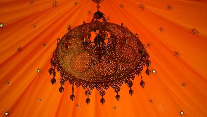 An ornate chandelier hangs in the center of the Ottoman Tent Folly in Winterthur Museum's garden follies exhibit.