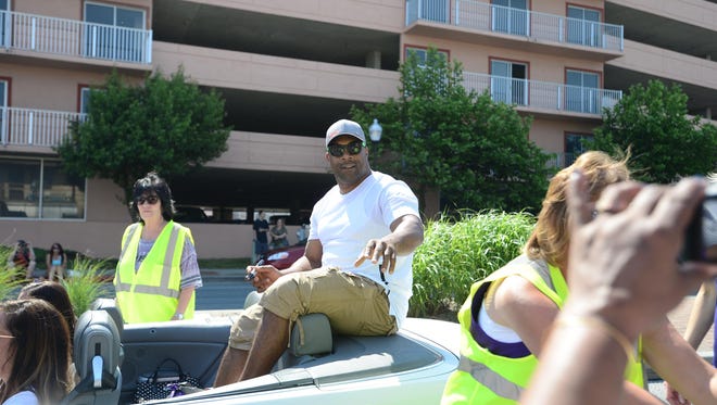Former Raven's running back Jamal Lewis signs autographs during the Raven's Roost parade in Ocean City on Saturday, June 3, 2017.