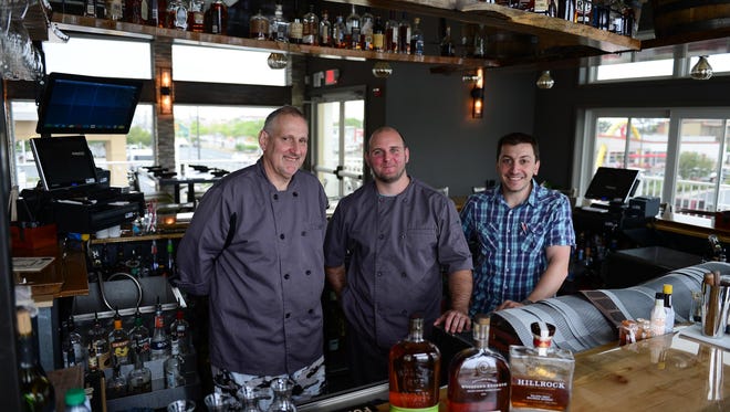 Joel Blice, Chef Stuart Diepold and Owner Sal Fasano stand behind the bar at the new Rare & Rye Restaurant located on 32nd St in the La Quinta Inn & Sweets on Tuesday, June 6, 2017.