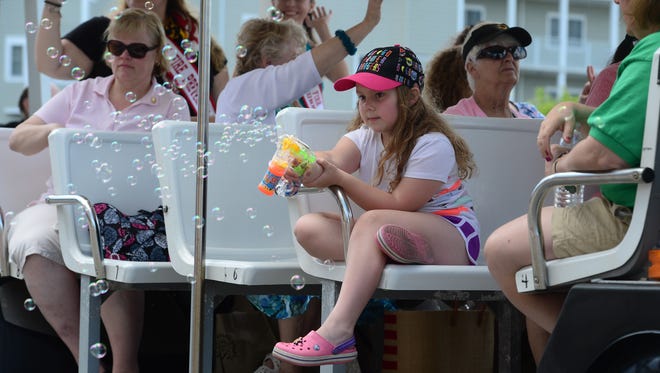 A little girl blows bubbles during the 2017 Maryland Fireman Association Parade held in Ocean City on Wednesday, June 21, 2017.
