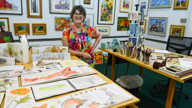 Rosemary Connelly stands in her Milford Art Studio Thursday, July 6, 2017. With the passing of her husband Bob, Connelly is ready to make a change and close the studio — she hopes to be out by the end of August or beginning of September — and is focusing on something that is a passion of hers: watercolor journaling.