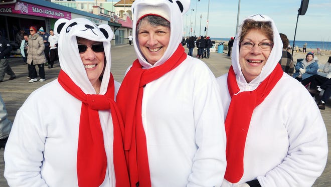 Janet Fowler, Lorna Wohl and Nancy Pezzino, all from Philadelphia, get ready to plunge as over 3,500 "Bears"  braved air temperatures of 49 degrees and water temperatures of 41 degrees to make the 26th Annual Lewes Polar Bear Plunge, held at Rehoboth Beach on Sunday to raise money for Delaware Special Olympics.