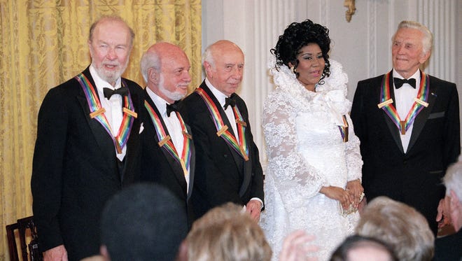 The recipients of the 1994 Kennedy Center Honors award attend a reception in evening on Sunday, Dec. 4, 1994 in the East Room of the White House. From left to right are songwriter Pete Seeger, director Harold Prince, composer Morton Gould, singer Aretha Franklin, and actor Kirk Douglas.