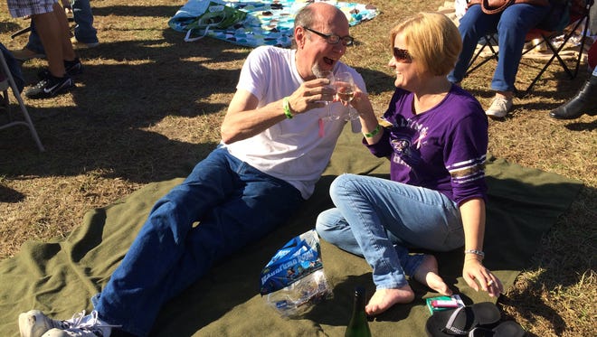 Baltimore couple Ron Vohs and Trina Unger enjoy the live music and a bottle of Riesling from Basignani Winery.