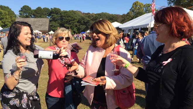 (From left) Friends Lisa Shockley, Kary Oppel, Rocki Kelly and Tracey enjoy the beautiful weather at the Autumn Wine Festival in Pemberton Park.