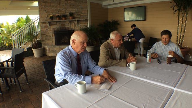 Maryland Sens. Ben Cardin (left) and Jim Mathias meet with area watermen over the summer to address concerns about shoaling in the Ocean City Inlet.