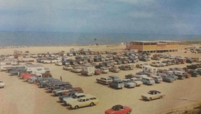 This vintage photo provided by Delaware Seashore State Park shows the beach parking area and one of the bathhouses circa 1975.