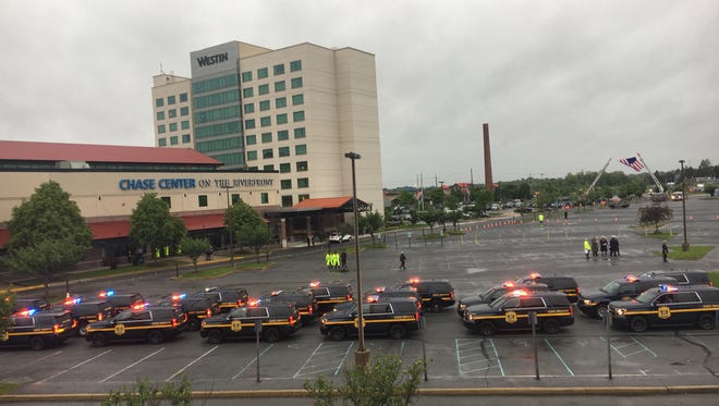 State Troopers begin to line up for the funeral of Cpl. Stephen Ballard at the Chase Center in Wilmington.