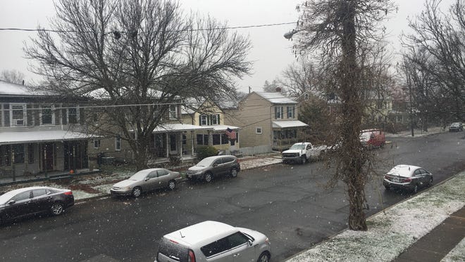 Snow falls in Delaware City.