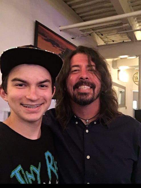 Dave Grohl with young fan Zach Laser at The Crab House near Rehoboth Beach on Aug. 3, 2016.