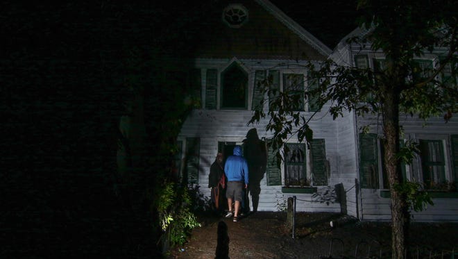 Guest enters a haunted house at Frightland last weekend during its preview weekend near Middletown.