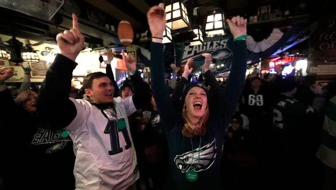 People react during Super Bowl 52 between the Philadelphia Eagles and the New England Patriots, Sunday, Feb. 4, 2018, in Philadelphia.