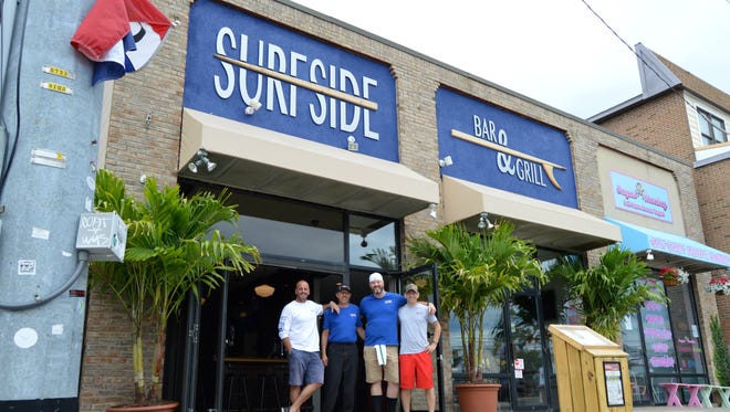 Surfside owner Tommy Simpson, with chef Karl Johnson, bartender Steve Bowers and floor manager Jason Knowles.