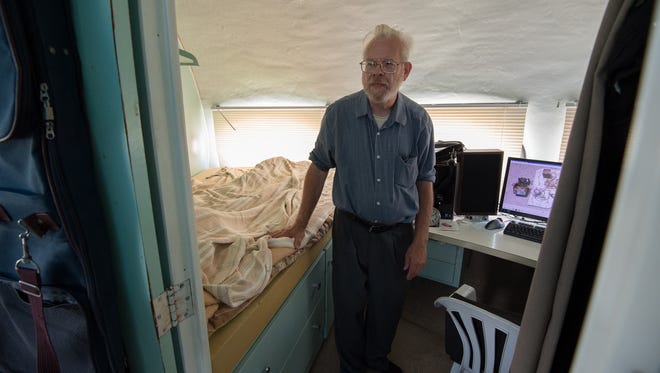 Richard Garrett stands inside his bedroom in the Futuro house in Milton.