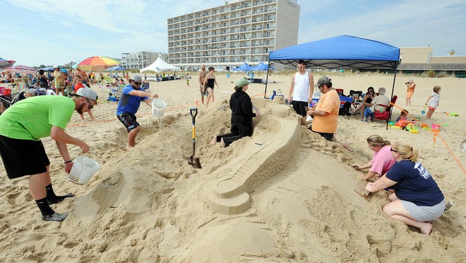 The Bollinger Family from Dagsboro, worked as a group to build their creation as The 38th Annual Rehoboth Beach-Dewey Beach Chamber of Commerce Sandcastle Contest was held Saturday, Sept. 10, 2016 at a new location on the south end of the beach near Funland under hot weather conditions.  Participants worked to create different castles and sculptures in the sand for judging in the late afternoon at which time trophy's ail be given out.