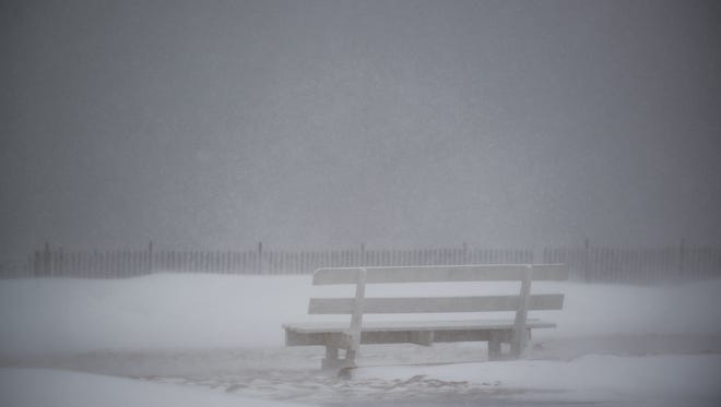 View a bench along Lewes Beach as winter storm Helena hits.
