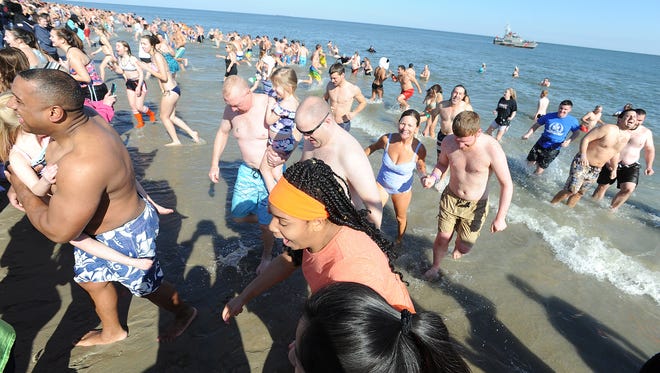 About $900,000 was raised Sunday with more than 3,500 "polar bears" taking the 26th Annual Lewes Polar Bear Plunge for Special Olympics Delaware.