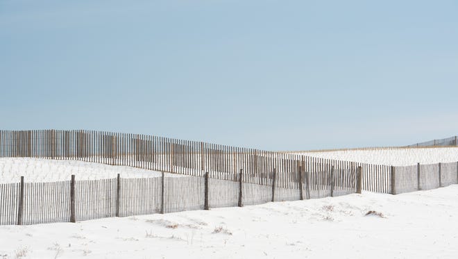 Snow covers the sand dunes at Broadkill Beach.