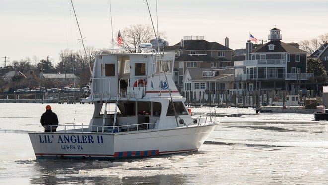 The Lil' Angler II makes a turn in the ice on the Lewes and Rehoboth canal in Lewes.